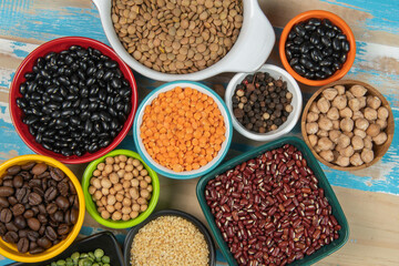 assorted bowls with raw grain and seeds top view