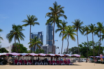 Wall Mural - Atmosphere on North Pattaya Beach, Pattaya City, Chonburi Province, Thailand. There are parasols, reclining chairs and food to serve tourists. Taken on 18 May 2023.