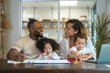 © tonefotografia - Happy African American parent playing and drawing with daughters in home