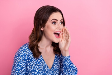 Poster - Profile photo of positive person arm near open mouth look communicate empty space isolated on pink color background