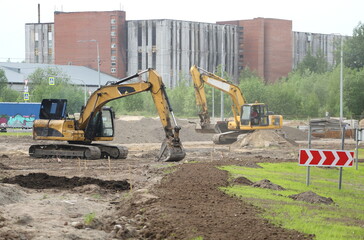 Excavators at the construction site, Soyuzny Prospekt, St. Petersburg, Russia, May 2023