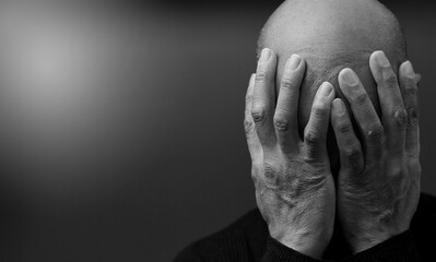 man praying to god with hands together Caribbean man praying on black background with people stock photos stock photo	