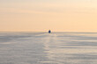 Cruise ship on the horizon, evening twilight at sea.