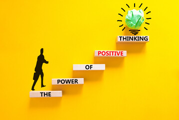 Wall Mural - Positive thinking symbol. Concept words The power of positive thinking on wooden block. Beautiful yellow background. Businessman icon. Business, motivational positive thinking concept. Copy space.