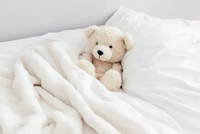Cute Little Teddy Bear Lying Sleeping Alone On White Bed In Morning, Generative Ai.