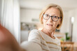 © Miljan Živković - Portrait of one mature blonde caucasian woman with eyeglasses at home