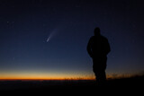 Fototapeta Zwierzęta - Neowise Comet silhouette of a person