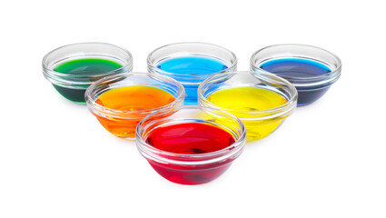 Wall Mural - Glass bowls with different food coloring on white background