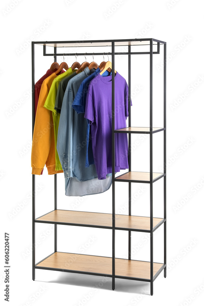 Shelving unit with male clothes on white background