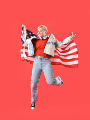 Sticker - Young woman with USA flag jumping on red background