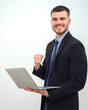 © เลิศลักษณ์ ทิพชัย - Portrait of happy young businessman a successful business man holding a laptop Looking at the camera confident and smiling Isolated over white wall background