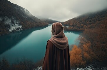 Mountaineer woman observes the views of a sunset on Lake. Generative Ai.