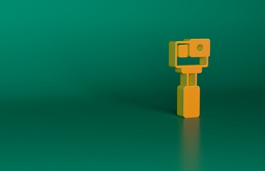 Sticker - Orange Action extreme camera icon isolated on green background. Video camera equipment for filming extreme sports. Minimalism concept. 3D render illustration