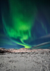 night landscape with northern lights and aurora winter by the sea