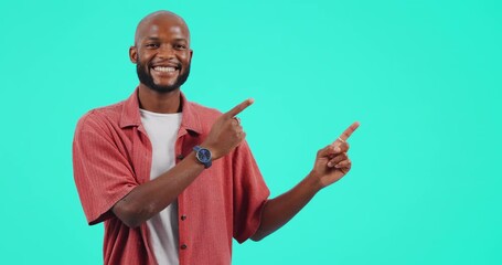 Wall Mural - Advertising, pointing and face of man in a studio with mockup space for product placement. Happy, smile and portrait of an African male model showing mock up for marketing isolated by blue background