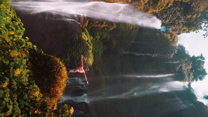 Wall Mural - Active lifestyle travel people enjoy the biggest waterfall Bali Sekumpul hidden in tropical rainforest jungle on nature background Bali, Indonesia 4K 