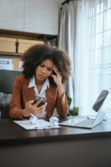 Wall Mural - Tired african american business woman working with audit, balance sheet, investing activities, safety stock, net loss, business risks, accumulated depreciation, factory overhead, accrued expense