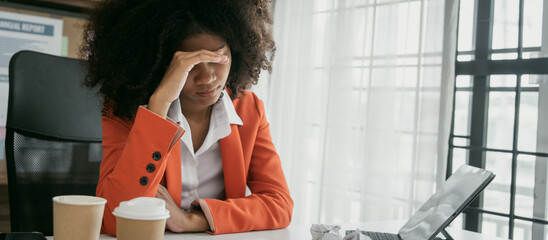 Tired african american business woman working with audit, balance sheet, investing activities, safety stock, net loss, business risks, accumulated depreciation, factory overhead, accrued expense