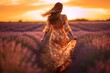 In the enchanting embrace of a sun-drenched afternoon, a woman gracefully wanders through a vibrant lavender field, her white sundress fluttering gently in the breeze. 