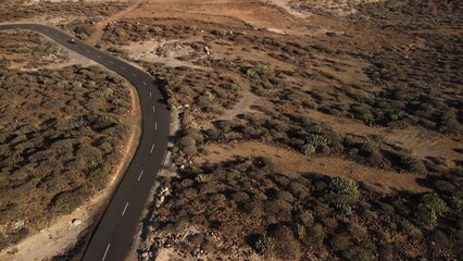 Sticker - Aerial shot of road running through barren desert terrain in Tenerife, Canary Islands