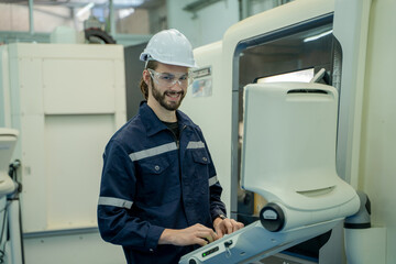 Fototapete - Engineer operating cnc machine in control panel at factory,Industry 4.0 concept.
