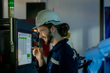 Fototapete - Engineer looking at screen and programming about performance of robotic arm,Researching and Developing a Technological Robot Arm Project.