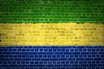 Sticker - Image of the Gabon flag painted on a brick wall in an urban location