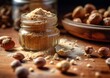 hazelnut flour spread on a wooden surface, along with whole and chopped hazelnuts