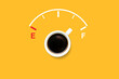 © Dadan - top view of black coffee with fuel gauge. concept of refueling energy for people with drinking coffee