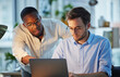 © N Lawrenson/peopleimages.com - Laptop, black man or manager training a worker with advice or research project in digital agency. Night, leadership or boss helping, coaching or speaking of SEO data or online business to employee