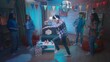 © kinomaster - The guy in white headphones listens to his music from the phone, dances to it. His friends look at him in shock, surprise in a room decorated for the party with a disco ball, balloons and paper flags.