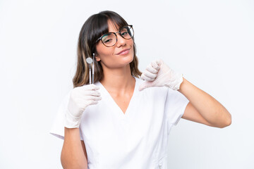 Wall Mural - Dentist caucasian woman holding tools isolated on white background proud and self-satisfied