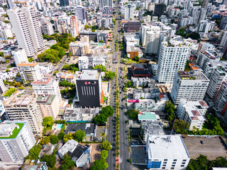 Aerial view above Abraham Lincoln street in the Santo Domingo city center. Skyscrapers and office buildings in downtown.