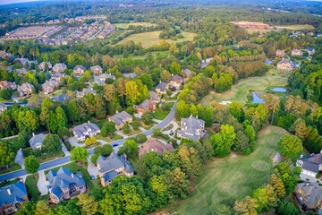 Wall Mural - Aerial panoramic view of an upscale subdivision shot during golden hour