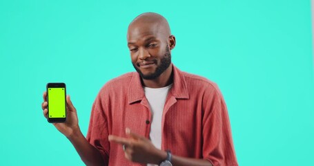 Poster - Man, phone and pointing finger at mockup or green screen for bad review on website. Confused black person with smartphone tracking markers in studio for app ux, poor network or internet problem