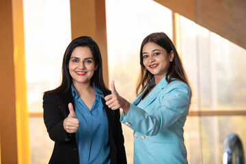 Canvas Print - Indian corporate women showing thumps up at office