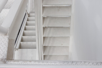 Poster - fire escape stair steel. white outdoor metal stair of building.