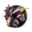 Purple vegetables isolated on white background. Purple basil, eggplant and bell pepper in metal bowl. Top view.