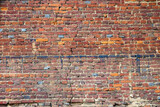 Fototapeta Do pokoju - Abstract red brick old wall texture background. Ruins uneven crumbling red brick wall
