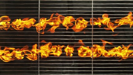 Wall Mural - Super Slow Motion Shot of Grill Grate with Briquettes and Fire Flames. Filmed on High Speed Cinematic Camera at 1000 FPS.