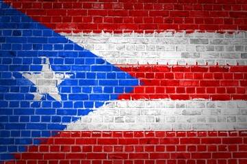 Sticker - Shot of the Puerto Rico flag painted on a brick wall in an urban location