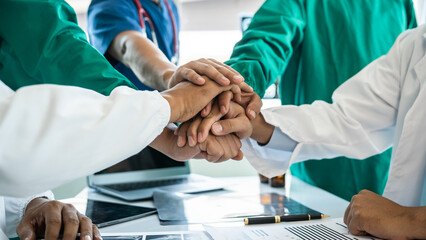 stack of hands of international doctor team meeting hospital medical staff.