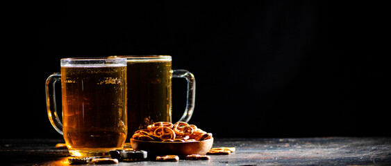 Wall Mural - Beer in glasses with salted pretzels.