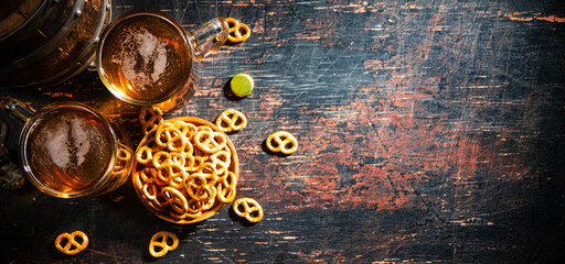 Wall Mural - Beer in glasses with salted pretzels.