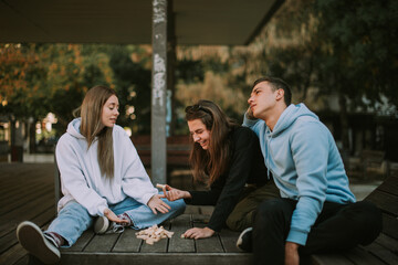 Three friends with scattered game