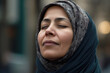 © Leon Waltz - Portrait of beautiful young muslim woman with closed eyes in the city