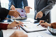 © Witoon - teamwork Business people are having a meeting to analyze data for business strategy planning. business idea