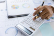 © Witoon - Modern male businessman or marketing data analyst working with laptop and graph data in office.