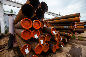 Rusted steel tubes with red plastic caps outdoor