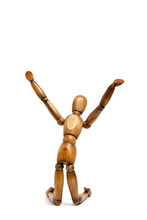 Figure Wooden Mannequin Kneeling With His Hands Raised Up.